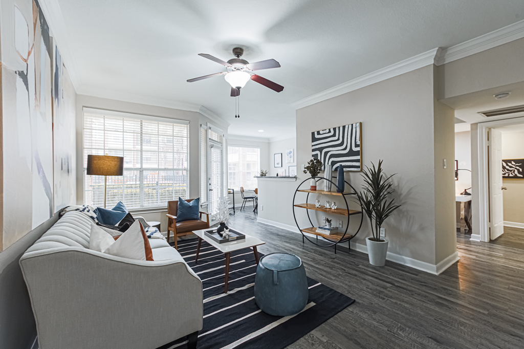 living room with hardwood-style flooring and ceiling fan