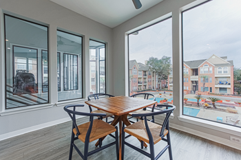 clubhouse lounge area with a table and chairs