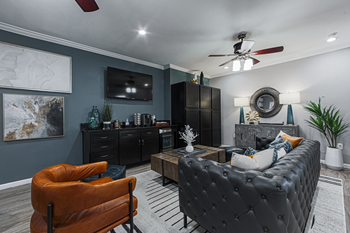 clubhouse with leather furniture and a tv