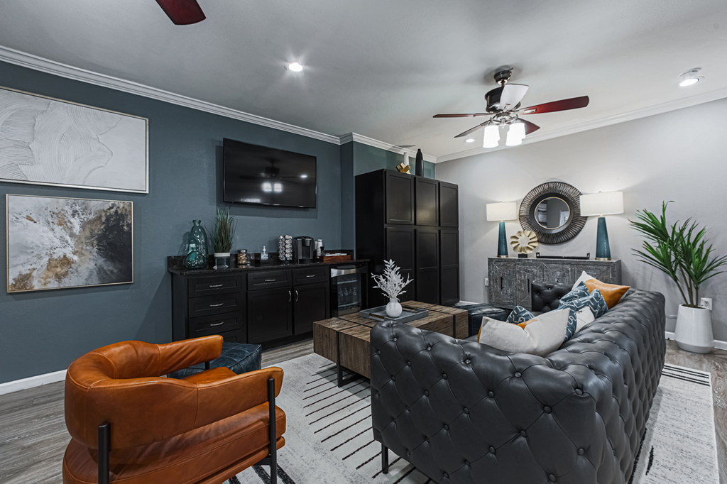 clubhouse with leather furniture and a tv