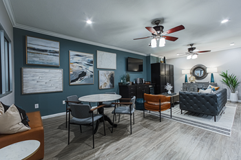 clubhouse lounge area with couch and table seating