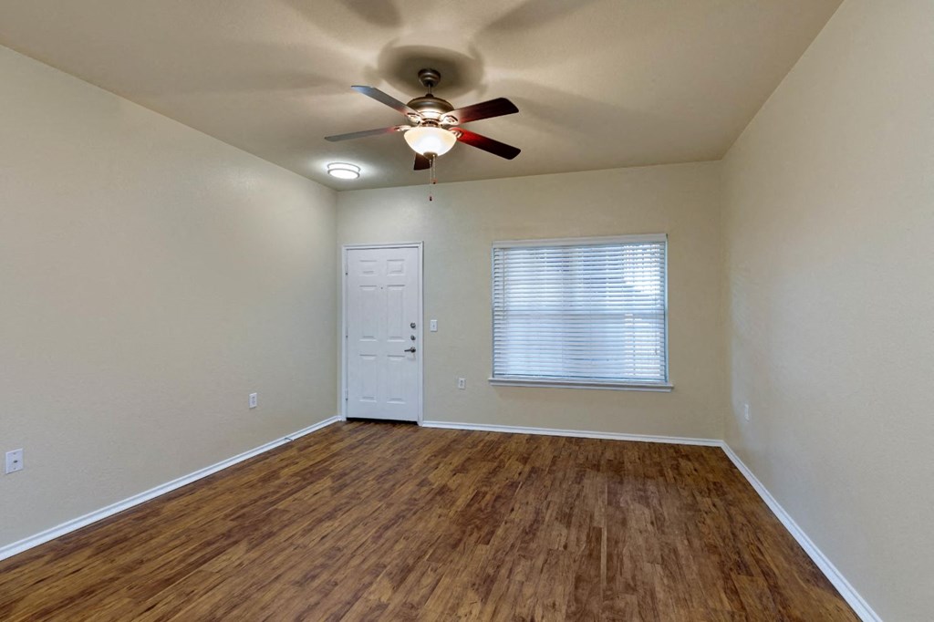 Living room with ceiling fan and hardwood style floors