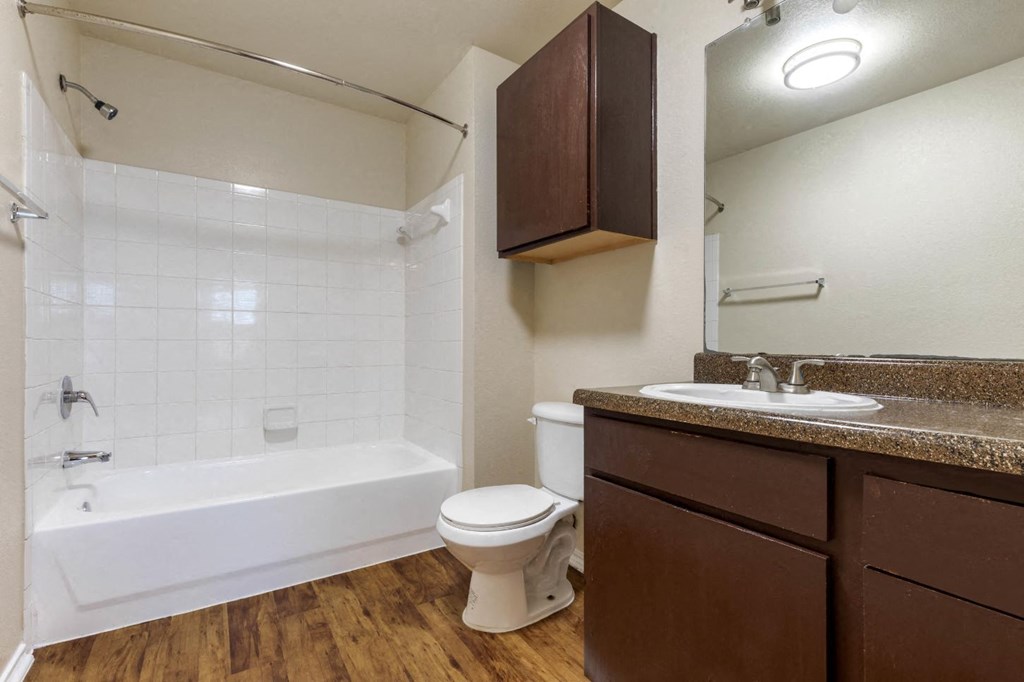 Bathroom with cabinet above storage