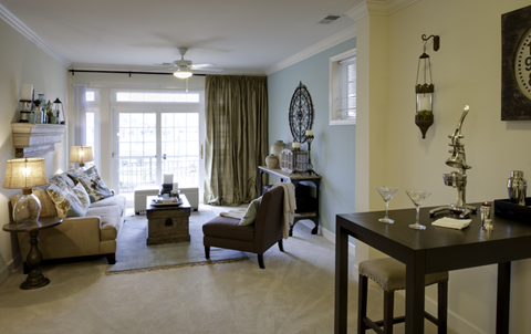 A living room with a couch, chair, and table.
