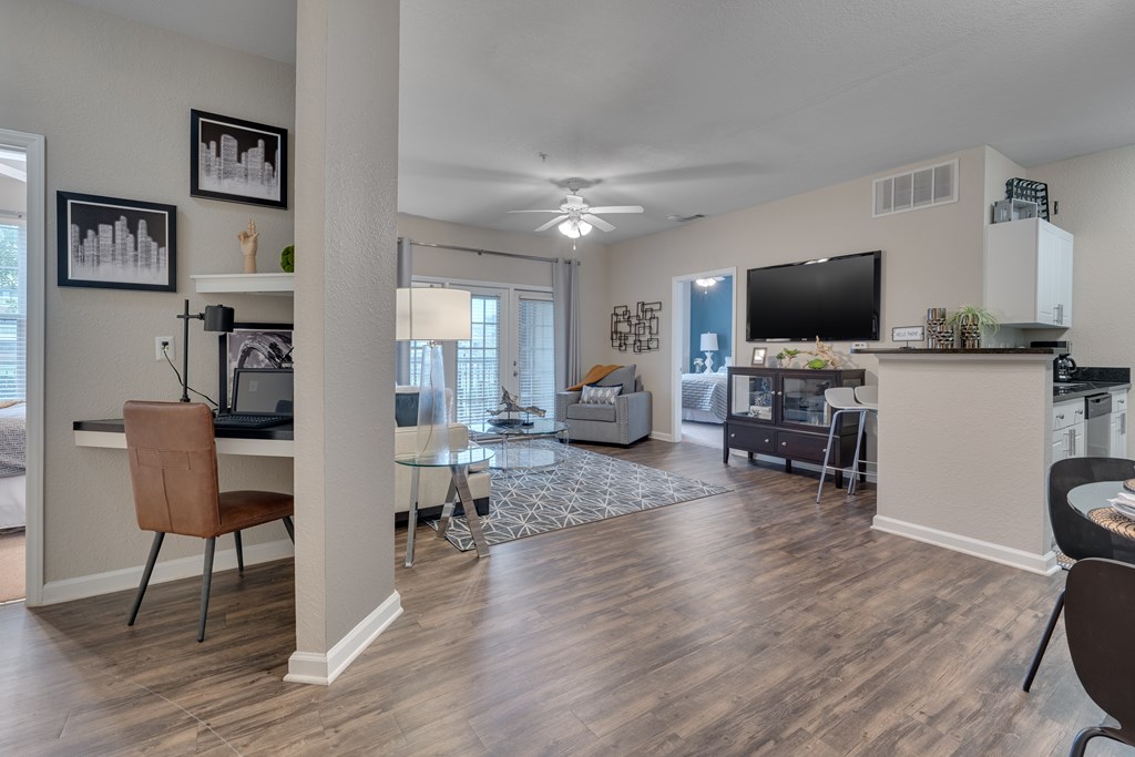 A living room with wood style flooring