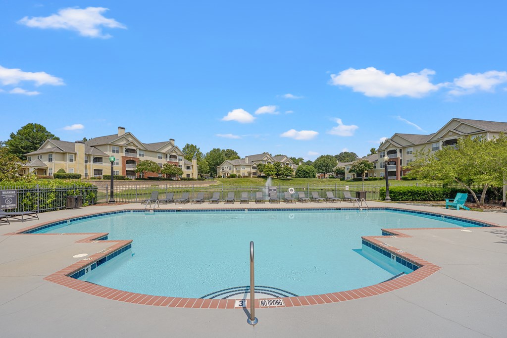 A swimming pool surrounded by apartment buildings