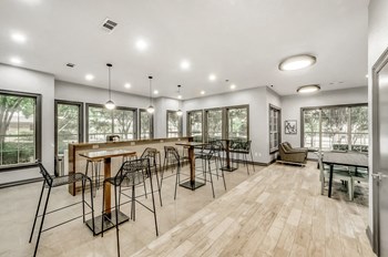 Clubhouse with a lounge sitting area with high top tables