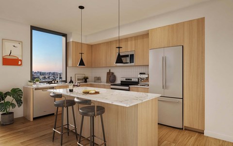 A kitchen with wooden cabinets and a marble countertop.