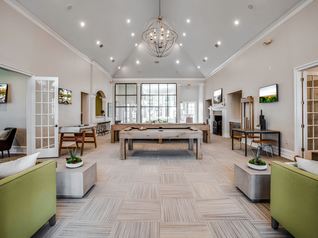 the preserve at ballantyne commons clubhouse with a pool table and a fireplace