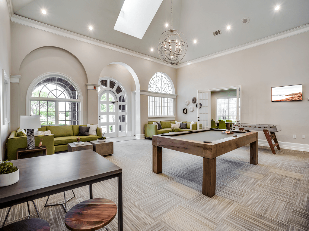 the preserve at ballantyne commons resident clubhouse with pool table and tables