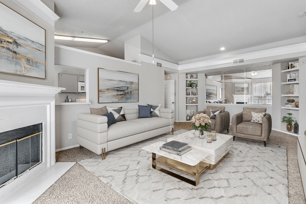 a living room with a fireplace and couches