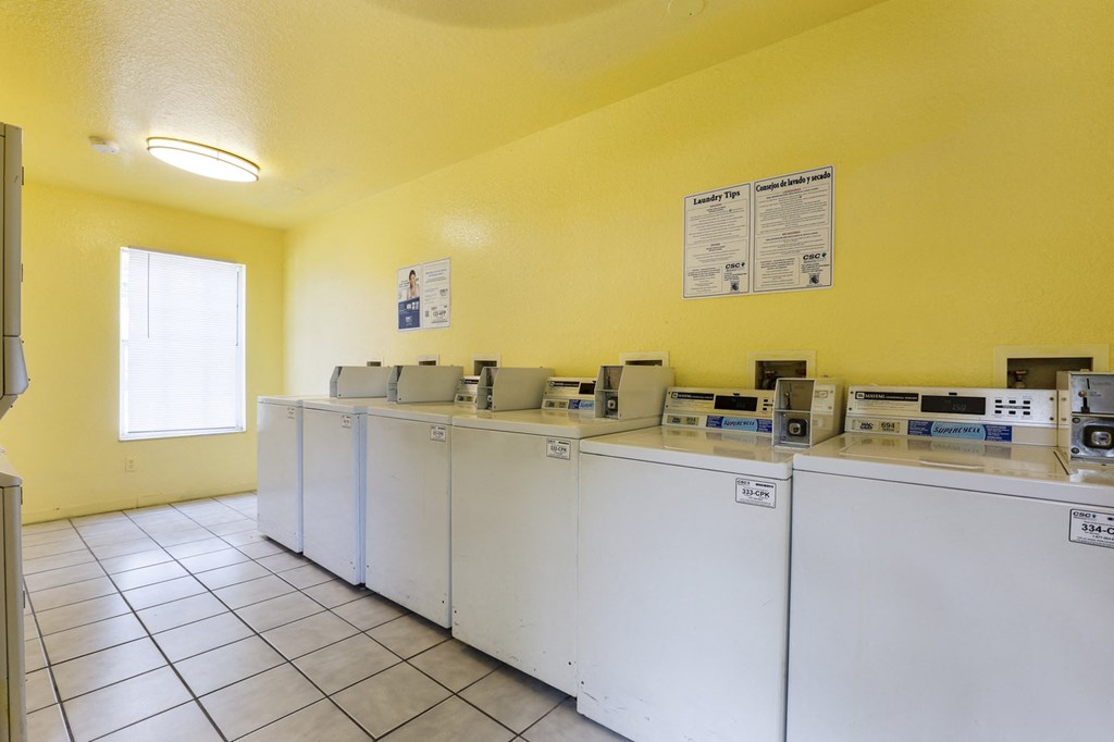 Laundry center with washer and tile flooring