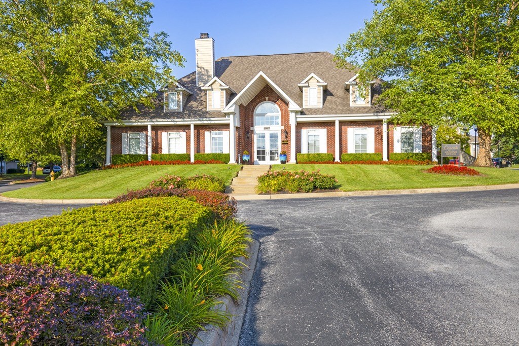 a house with a driveway and a street in front of it