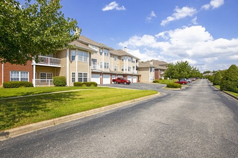 a street with houses on either side of a road