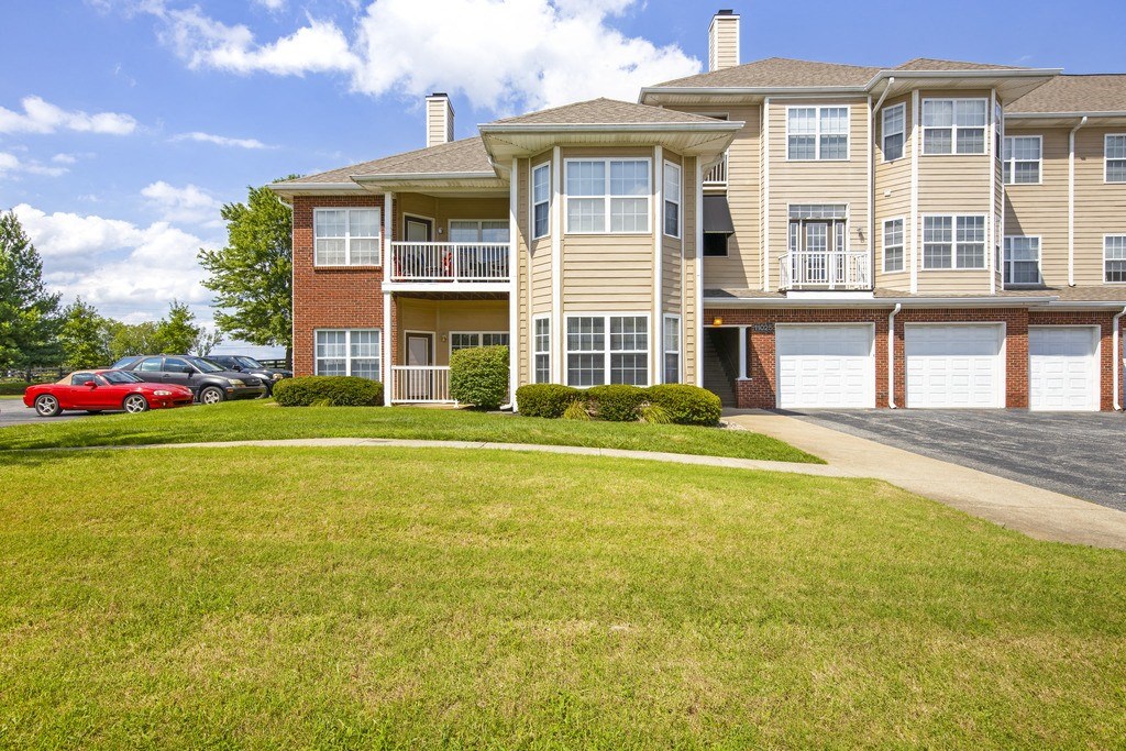 a large house with a lawn in front of it