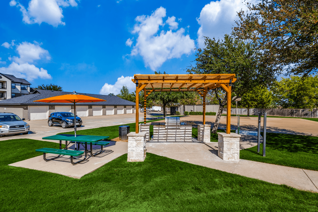 a picnic area with benches and a pavilion