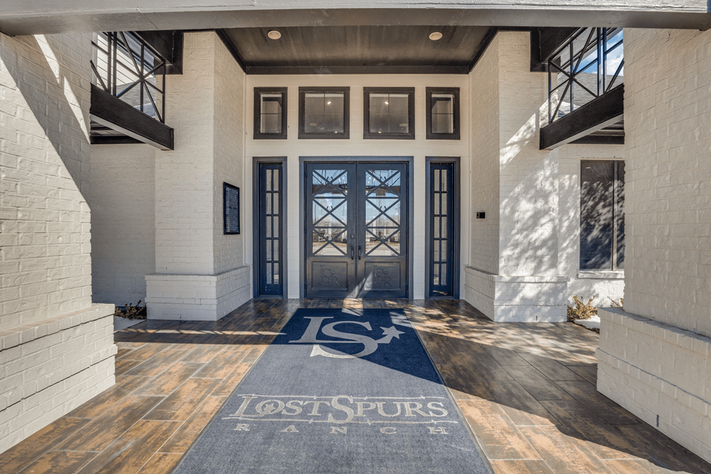 a lobby with a lost spores logo in front of a door