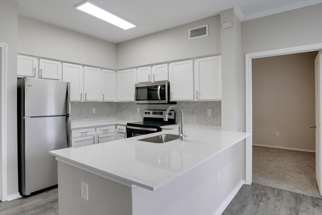 the preserve at ballantyne commons apartment kitchen with stainless steel appliances