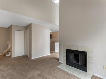 Carpeted Living Room with Fireplace