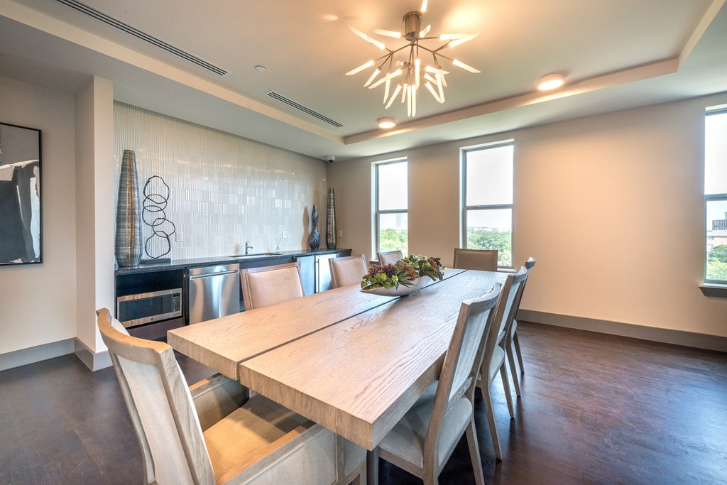 Resident conference area facing a refrigerator and decorative lighting