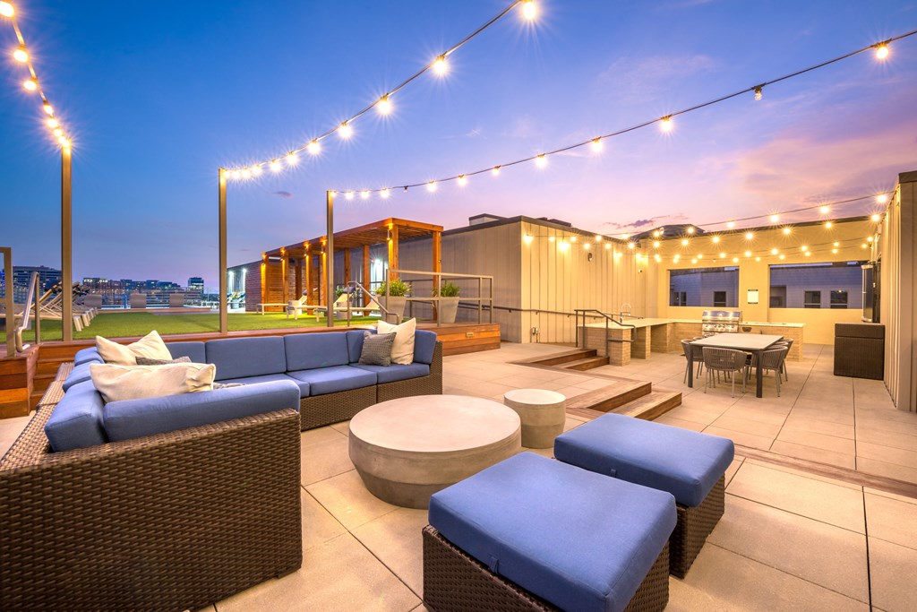Outdoor grilling area facing extra guest seating and downtown Dallas