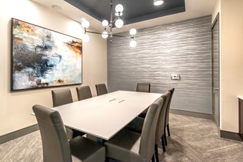 Conference area facing long table and decorative lighting. - Photo Gallery 56