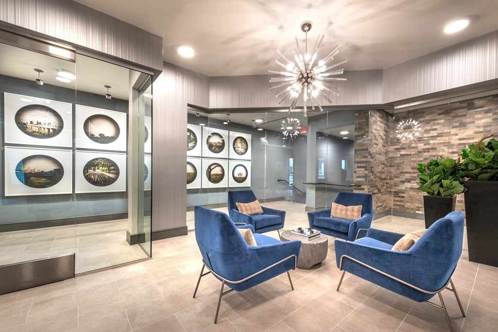 Resident sitting area inside the sky lounge facing decorative lighting.