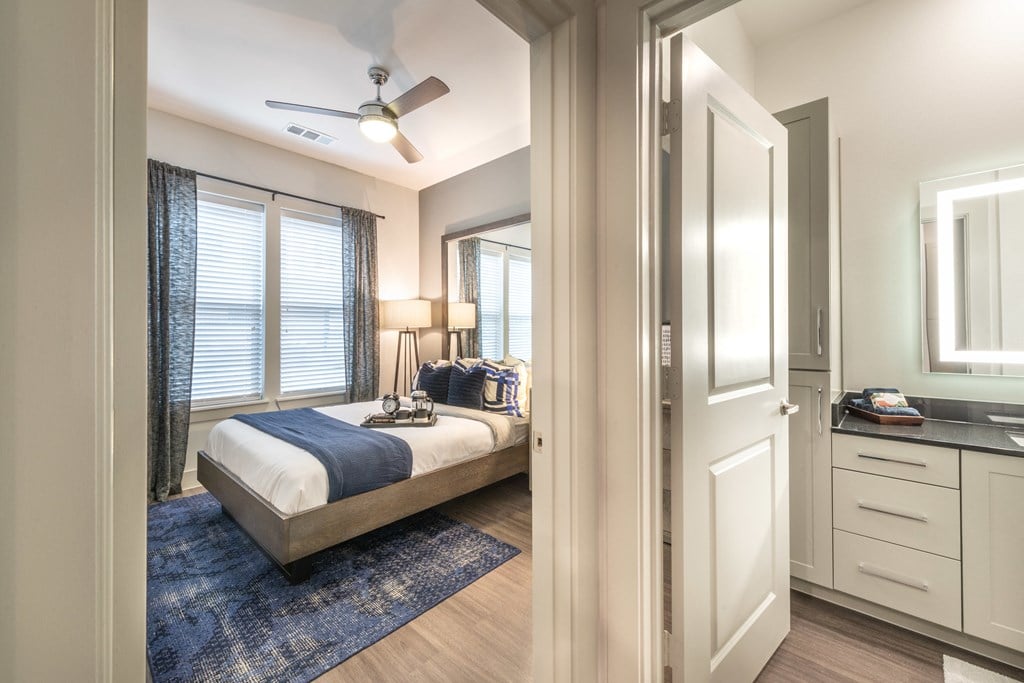 View into the bedroom and bathroom from the hallway