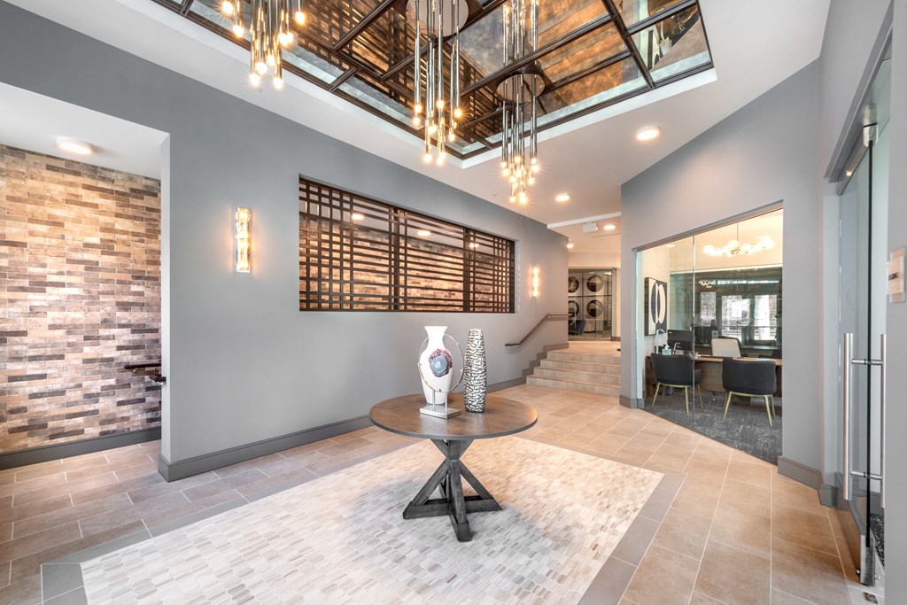 Interior of leasing office facing decorative lighting and an office