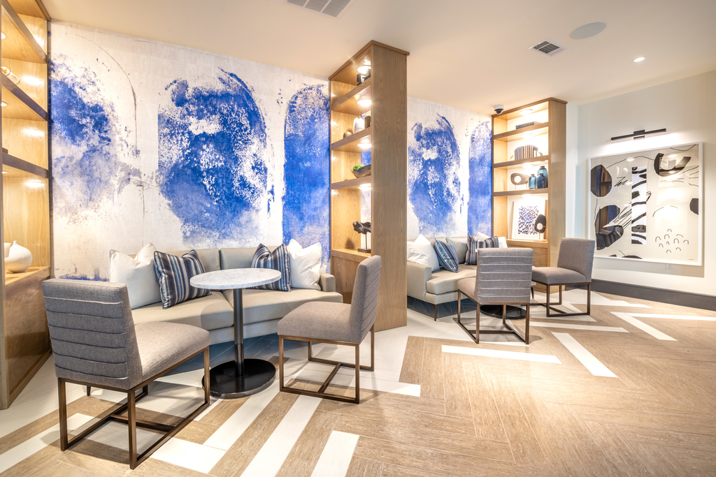 Clubhouse lounge area with private spaces with couch, table and chairs