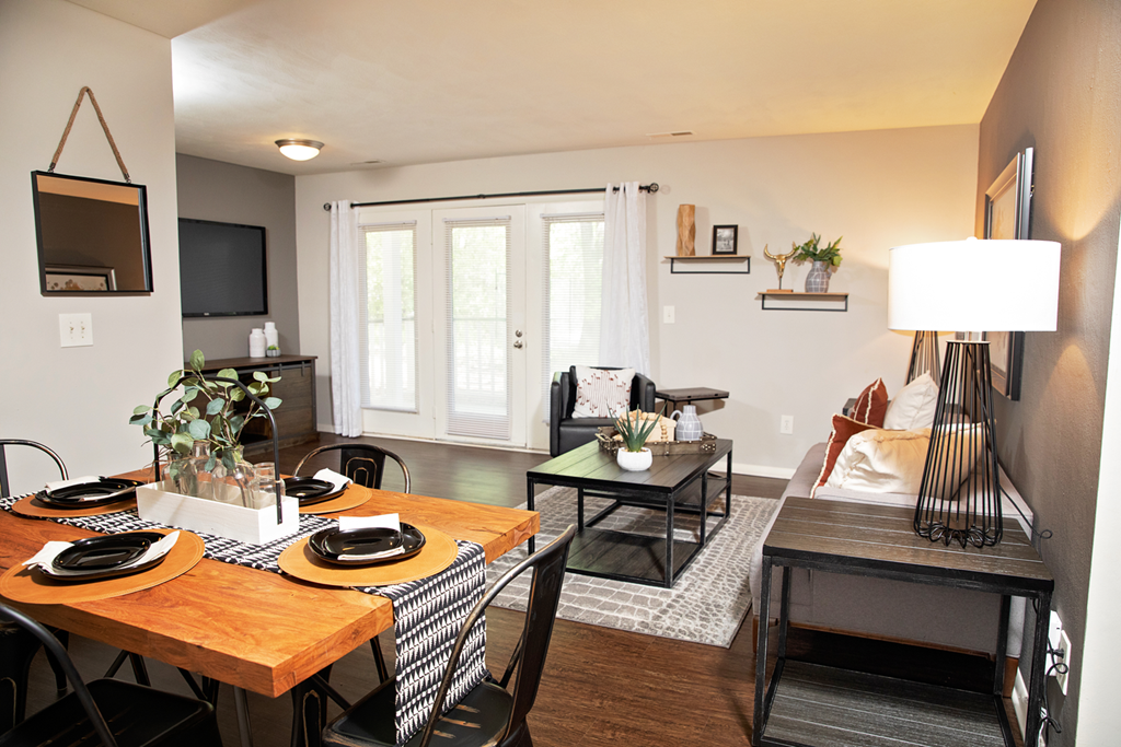 living and dining rooms with hardwood-style flooring