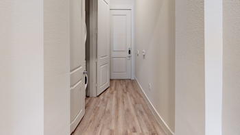 Entry way with wood style flooring and closet with washer and dryer - Photo Gallery 63