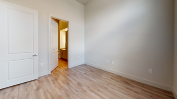 Bedroom with wood style flooring and en-suite bathroom entry - Photo Gallery 68
