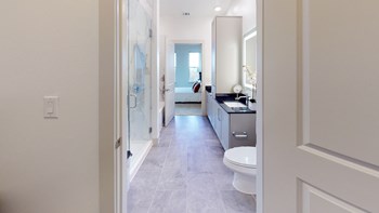 Interior of bathroom facing stand-in shower and sink from the closet - Photo Gallery 91