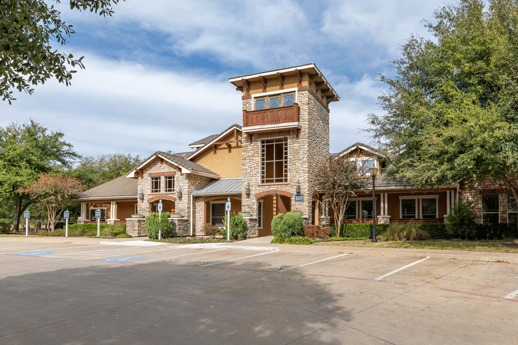 Leasing Office with a parking lot in front of it