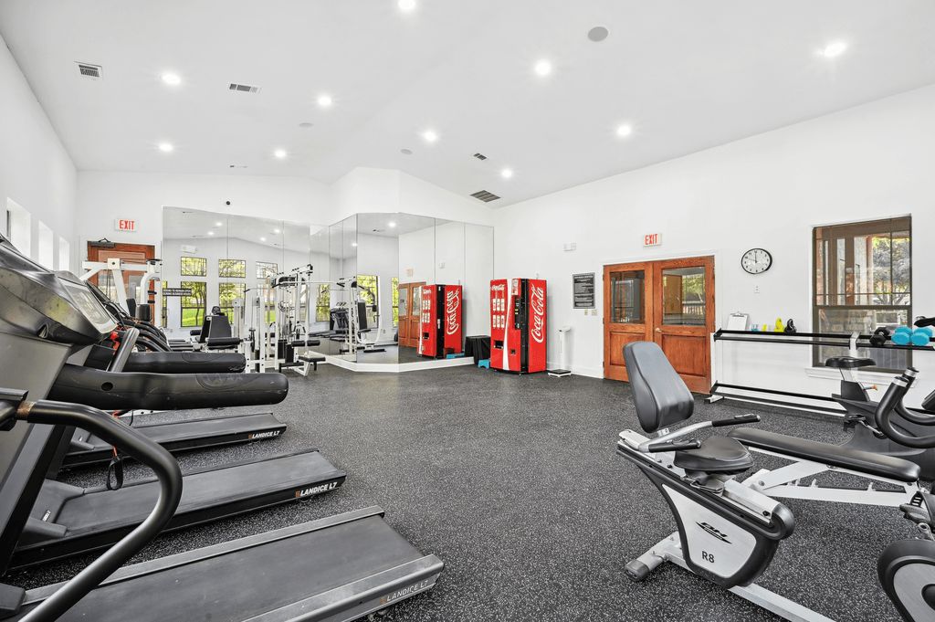 the gym is equipped with cardio equipment and free weights