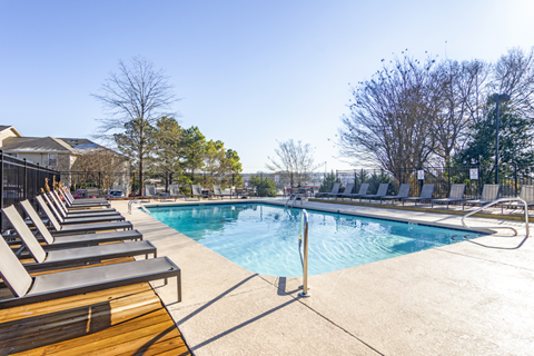 pool with chairs on either side of pool