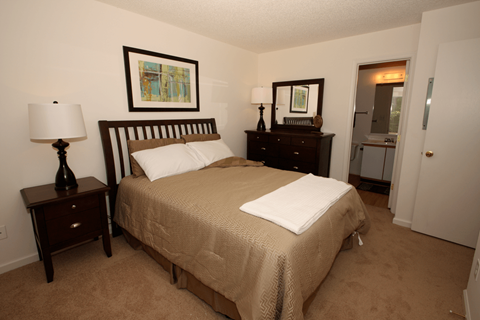 a bedroom with a bed and two night stands