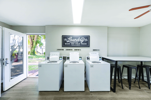 A laundry room with a washer and dryer in it.