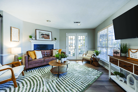 A living room with a fireplace and a couch.