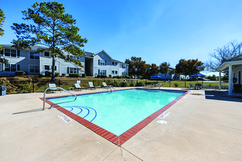 A swimming pool with a red border and blue lines in the middle.