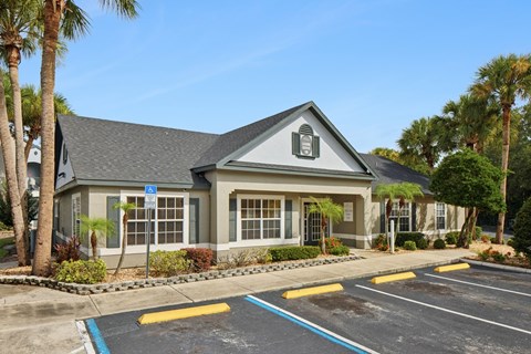A building with a parking lot in front of it.