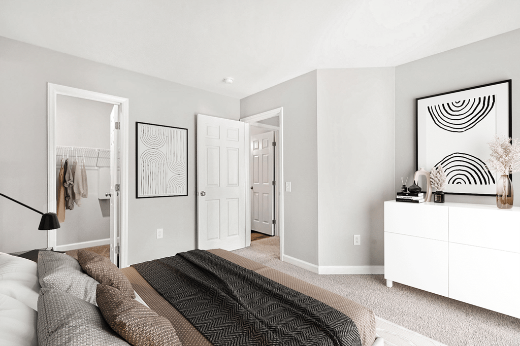 A room with a grey carpet and a white dresser at Paces Pointe Apartment Homes, Matthews, NC, 28105