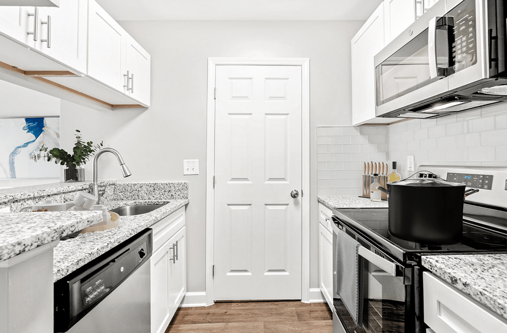 A kitchen with a black pot on the stove at Paces Pointe Apartment Homes, Matthews, NC