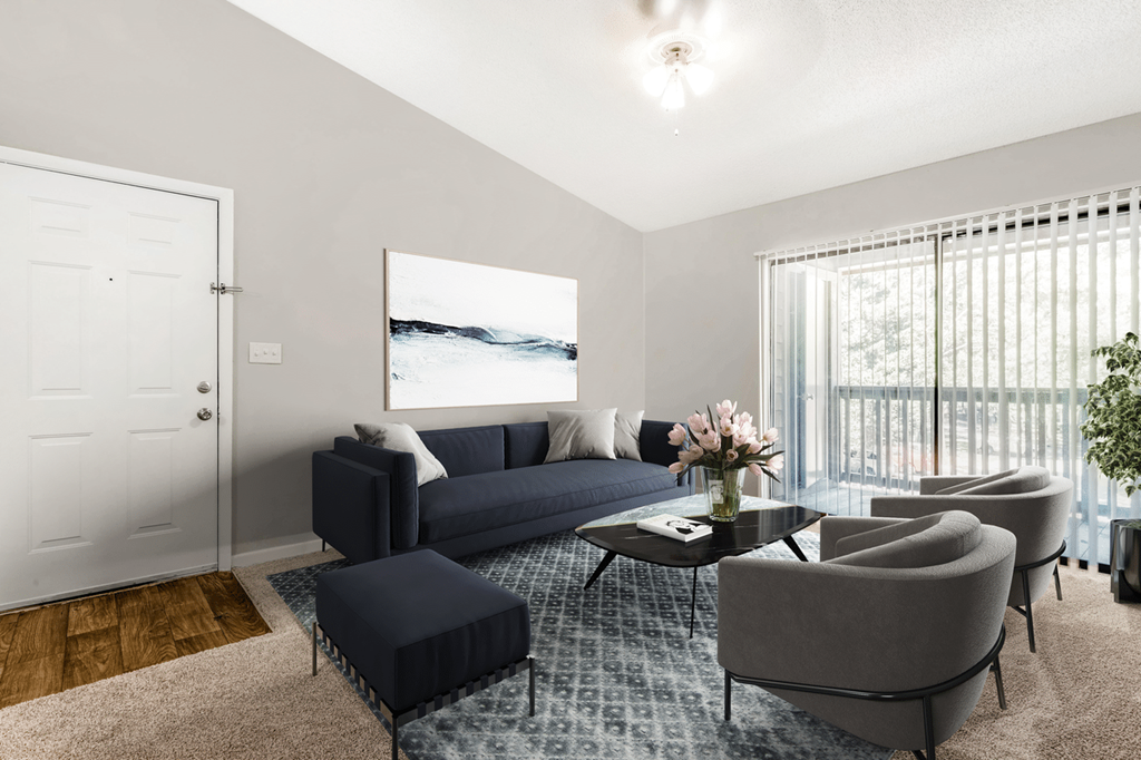 A living room with a couch, chairs, and a coffee table at Paces Pointe Apartment Homes, Matthews