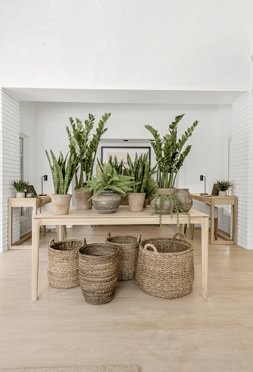 A table with potted plants and baskets on it at Paces Pointe Apartment Homes, Matthews, NC, 28105