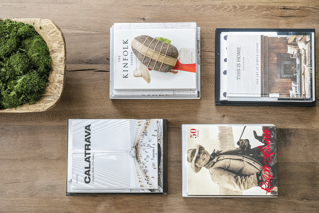 A wooden table with four different books on it at Paces Pointe Apartment Homes, North Carolina, 28105