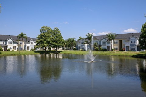 Waterfront View with Apartment Building Exterior and Trees