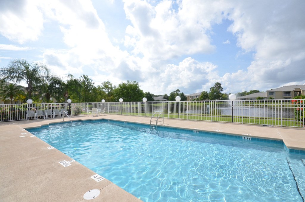 Swimming Pool And Relaxing Area at River Park Place Apartments, Florida