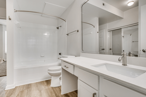 a bathroom with a toilet sink and bathtub
